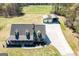 A bird's-eye view of the house and detached garage and the surrounding lush landscape at 640 Lovell Rd, Temple, GA 30179