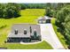 Stunning aerial view highlights the sprawling property with lush lawns and a spacious detached garage at 640 Lovell Rd, Temple, GA 30179