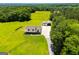 Gorgeous aerial view of a well-maintained home and detached garage on a large, beautifully landscaped property at 640 Lovell Rd, Temple, GA 30179
