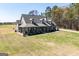 An elevated view of the charming craftsman home with a welcoming front porch at 640 Lovell Rd, Temple, GA 30179