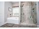 Spa-like bathroom features a large soaking tub and tiled shower with glass door at 640 Lovell Rd, Temple, GA 30179
