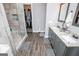 Beautiful bathroom featuring double vanities, tiled shower, and a walk-in closet at 640 Lovell Rd, Temple, GA 30179