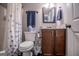 Bathroom features shower/tub, vanity with dark cabinets, and toilet at 640 Lovell Rd, Temple, GA 30179
