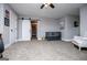 Large bedroom with sliding barn door, crib and sitting area that offers serene space at 640 Lovell Rd, Temple, GA 30179