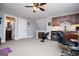 Spacious room featuring kitchenette, exercise space, and gray carpeted floors at 640 Lovell Rd, Temple, GA 30179