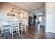 Open dining room featuring hardwood floors and natural light, seamlessly connecting to the living area for easy entertaining at 640 Lovell Rd, Temple, GA 30179