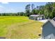 Home aerial with expansive yard, detached garage, and ample parking at 640 Lovell Rd, Temple, GA 30179