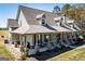 Charming exterior with a welcoming front porch, perfect for relaxing and enjoying the view at 640 Lovell Rd, Temple, GA 30179