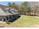 Charming exterior with a sprawling lawn and a welcoming front porch perfect for relaxing at 640 Lovell Rd, Temple, GA 30179