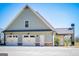 A large home with a long driveway leading to the side facing garages at 640 Lovell Rd, Temple, GA 30179
