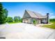 Stylish home with a two-car garage, outdoor patio, and a well-manicured lawn at 640 Lovell Rd, Temple, GA 30179