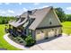 Beautiful home with a two-car garage, manicured landscaping, and a covered front porch and stylish architectural details at 640 Lovell Rd, Temple, GA 30179