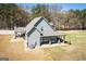 Beautiful backyard with a covered patio, ideal for entertaining or enjoying the peaceful setting at 640 Lovell Rd, Temple, GA 30179
