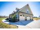Beautiful home showcasing an attached garage and a curved sidewalk at 640 Lovell Rd, Temple, GA 30179