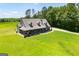 A picturesque home featuring a welcoming front porch and expansive front yard at 640 Lovell Rd, Temple, GA 30179