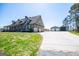 Stunning home with an attached three-car garage, and a detached garage at 640 Lovell Rd, Temple, GA 30179