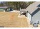 An exterior view featuring a covered porch, patio, and complementary rock landscaping at 640 Lovell Rd, Temple, GA 30179