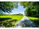 Sprawling property featuring a large lawn, long driveway, and a detached garage at 640 Lovell Rd, Temple, GA 30179