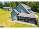 A charming home exterior featuring a welcoming front porch and lush green lawn at 640 Lovell Rd, Temple, GA 30179