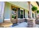 Inviting front porch with a stylish front door, stone pillars, and a welcoming wreath at 640 Lovell Rd, Temple, GA 30179