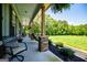 Inviting front porch with comfortable seating and a swing, perfect for relaxing and enjoying the outdoor scenery at 640 Lovell Rd, Temple, GA 30179