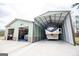 This building features an enclosed garage and an open garage to store a trailer at 640 Lovell Rd, Temple, GA 30179