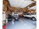 The large garage is equipped with an American flag, truck, golf cart, and lawn mower at 640 Lovell Rd, Temple, GA 30179