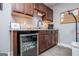 The kitchenette features cabinets, granite countertops, a beverage fridge, and a coffee maker at 640 Lovell Rd, Temple, GA 30179