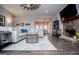 Inviting living room features a stone fireplace, hardwood floors, and open layout, ideal for gatherings at 640 Lovell Rd, Temple, GA 30179