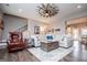 Spacious living room with a windmill ceiling fan and cozy furniture at 640 Lovell Rd, Temple, GA 30179