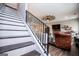 View of living room from the stairway, featuring hardwood floors, fireplace, and stylish decor at 640 Lovell Rd, Temple, GA 30179