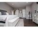 Spacious main bedroom featuring hardwood floors, light gray walls, and a large decorative dresser at 640 Lovell Rd, Temple, GA 30179