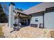 Covered patio with ceiling fan, outdoor seating, fireplace, and access to a large backyard at 640 Lovell Rd, Temple, GA 30179