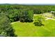 Expansive lawn with tree line showing potential for residential living, recreation, and outdoor enjoyment at 640 Lovell Rd, Temple, GA 30179