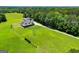 Aerial showing expansive yard with house and detached garage, offering ample space and privacy at 640 Lovell Rd, Temple, GA 30179