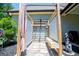 Outdoor shower area with a wooden bench, privacy screen, and stone ground cover, creating a backyard oasis at 640 Lovell Rd, Temple, GA 30179