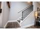 Stairway featuring dark wood steps and black metal railing at 640 Lovell Rd, Temple, GA 30179