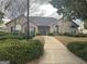 View of the community clubhouse exterior surrounded by well-manicured landscaping at 227 Fenwick Cir, Mcdonough, GA 30253