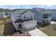 Aerial view of a modern two-story home showcasing its curb appeal and landscaping at 813 Royal Red Ct, Mcdonough, GA 30253