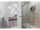 Modern bathroom featuring a glass shower and a peek into the adjacent bedroom at 813 Royal Red Ct, Mcdonough, GA 30253