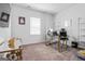 Bright office space featuring an executive desk, stylish decor, and ample lighting at 813 Royal Red Ct, Mcdonough, GA 30253