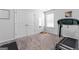 Exercise room with neutral carpet, exercise equipment, and bright natural light at 813 Royal Red Ct, Mcdonough, GA 30253