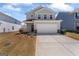 Charming two-story home features a two-car garage and a well-maintained front yard with fresh landscaping at 813 Royal Red Ct, Mcdonough, GA 30253