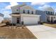 Charming two-story home features a two-car garage and a well-maintained front yard with fresh landscaping at 813 Royal Red Ct, Mcdonough, GA 30253