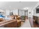 Spacious living room with a fireplace, modern furniture, and an open layout connected to the kitchen at 813 Royal Red Ct, Mcdonough, GA 30253