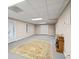 Finished basement with a large area rug, and an electric fireplace at 346 Buckingham Sw Dr, Conyers, GA 30094