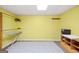 Basement area with a utility sink, an ironing board, and shelving for storage at 346 Buckingham Sw Dr, Conyers, GA 30094