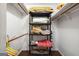 Walk-in closet with wood-style floor and multiple shelves stacked with blankets and pillows at 346 Buckingham Sw Dr, Conyers, GA 30094