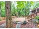 A beautiful wood deck is surrounded by lush greenery and offers ample space for relaxation and entertainment at 346 Buckingham Sw Dr, Conyers, GA 30094