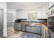Kitchen featuring stainless steel appliances, butcher block countertops, gray cabinets, and luxury vinyl plank flooring at 346 Buckingham Sw Dr, Conyers, GA 30094